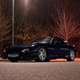A beautiful black Mazda RX-7 of the FD generation.